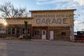 Old garage building in Goldfield nevada late in the evening with sunset Royalty Free Stock Photo