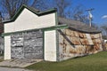 Old garage with disintegrating metal siding