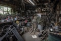 old garage full of tools, equipment, and parts that have been left behind after business has closed