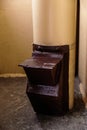 Old garbage chute in apartment building with cheap apartments - Rubbish chute in a Soviet block of flats Royalty Free Stock Photo