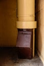 Old garbage chute in apartment building with cheap apartments - Rubbish chute in a Soviet block of flats Royalty Free Stock Photo