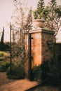 Old garden gate Stone arch entrance wall Royalty Free Stock Photo