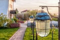 Old garden light with waterproof cover in sunset rays. Landscape design Royalty Free Stock Photo