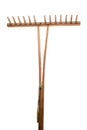 Old garden rake on white background