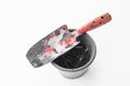 Old garden spade with soil in flower plot on white background Royalty Free Stock Photo