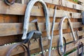 Old garden tools and animal-drawn on a fence