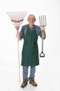 Old gardener with tools Royalty Free Stock Photo