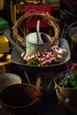 Old Gardening Equipment and Flowers in a Junk Shop Royalty Free Stock Photo