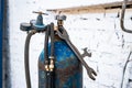 Old gas cylinders for welding and cutting. Rusty propane and oxygen tanks.