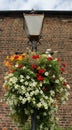 Old Gas lamp post with flowers Royalty Free Stock Photo