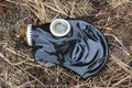 Old gas mask lies on the wilted grass after the rain. concept: biological and gas danger, the end of the world, Apocalypse, death