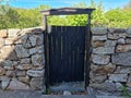 Old gate doors in Ertholm - fence of stones Royalty Free Stock Photo