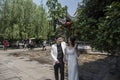 Young couple taking wedding photos in scenic area