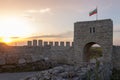 Old gate guarding the entrance of the medieval fortress in Kaliakra  Cape, Bulgaria, on a sunny spring day at sunset Royalty Free Stock Photo