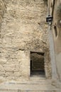 Old gate in medieval alley Royalty Free Stock Photo