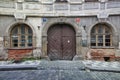 Closed wooden door of a home with siding in daytime. the old gate Royalty Free Stock Photo