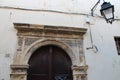 old gate with a sculpted stone arc and wood doors in rethymno in crete (greece)