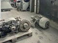 Old gear and gears lying on a pallet and an electric motor Royalty Free Stock Photo