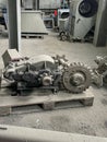 Old gear and gears lying on a pallet and an electric motor Royalty Free Stock Photo