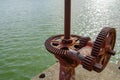 Old gear and rusted cogwheel mechanism, cog gear wheel for water