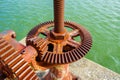 Old gear and rusted cogwheel mechanism, cog gear wheel for water