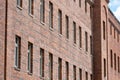 Old generic prison building in the city, jail exterior detail closeup, arrest, side windows, facade, nobody Imprisonment, sentence Royalty Free Stock Photo