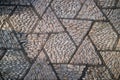 Old geometric pattern cobblestone paving stone road