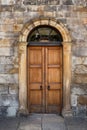 Old Georgian stone townhouse door with fanlight window above door