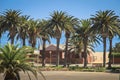 an old German building surrounded by palm trees Royalty Free Stock Photo