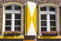 Old German house with windows with wooden shutters Royalty Free Stock Photo