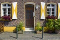 Old German house with wooden door and windows with wooden shutters Royalty Free Stock Photo