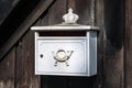 Old german mailbox on a wooden fence Royalty Free Stock Photo