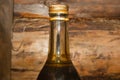 Old glass bottle with technical fluid in workshop