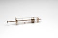 Old glass multiple use syringe without needle. Vintage medical glass syringe Royalty Free Stock Photo