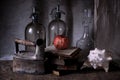 Old glass water siphons, iron, old books, shell.