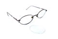 Old glasses with broken brown lens and frame isolated on white background Royalty Free Stock Photo