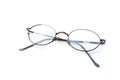 Old glasses with broken brown lens and frame isolated on white background Royalty Free Stock Photo