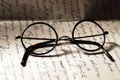 Old glasses on a letter