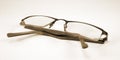 Old glasses in sepia tint on white background