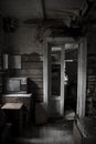 An old gloomy room in an abandoned house. Antique TV. Royalty Free Stock Photo