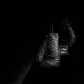 Old gloves on a black background Royalty Free Stock Photo