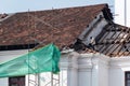 Workers fixing the tiles on the roof during the restoration of the St. Francis of Assisi church