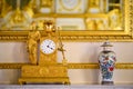 Old gold clock on the fireplace Royalty Free Stock Photo