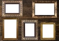 Old Gold Picture Frames on wooden wall Royalty Free Stock Photo