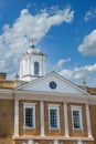 Old Gold Plaster Building with Weathervane and Cupola