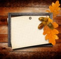 The old gold wooden frame on grange wall with oak leaves