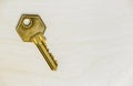 Old golden retro key, real estate background Royalty Free Stock Photo