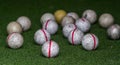 Old golf balls on artificial grass