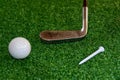 Old golf club on the tee off ready to hit the ball Royalty Free Stock Photo