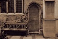 Old gothic church door bricked up and the bench nearby Royalty Free Stock Photo